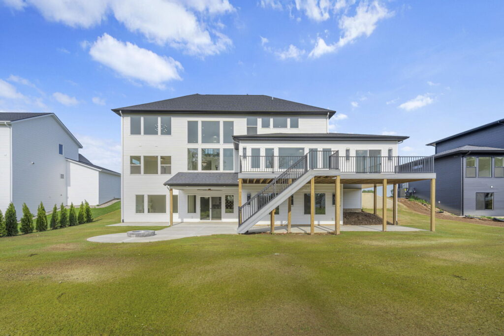 a three-story custom home with many windows