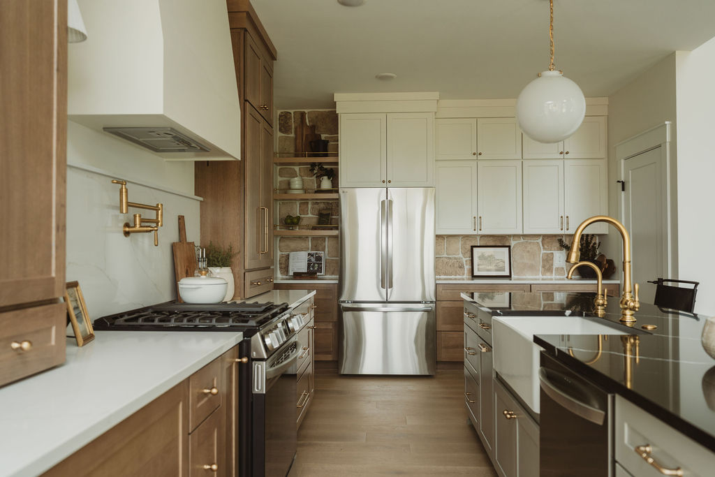 Kitchen with stone backsplash and stainless appliances
